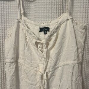 White cotton mini summer dress with doily style cut outs.